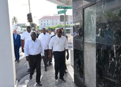 Prime Minister the Hon. Philip Davis, Deputy Prime Minister the Hon. Chester Cooper, and other government officials inspect buildings on Bay Street that are to be demolished. (BIS Photo - Kemuel Stubbs)
