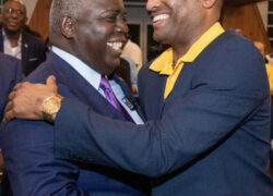 Progressive Liberal Party Leader Philip Brave Davis shares a moment with party candidate for West Grand Bahama and Bimini Kingsley Smith.