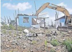 Shanty Town demolition begins.