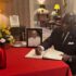 AMBASSADOR JONES SIGNS BOOK OF CONDOLENCE